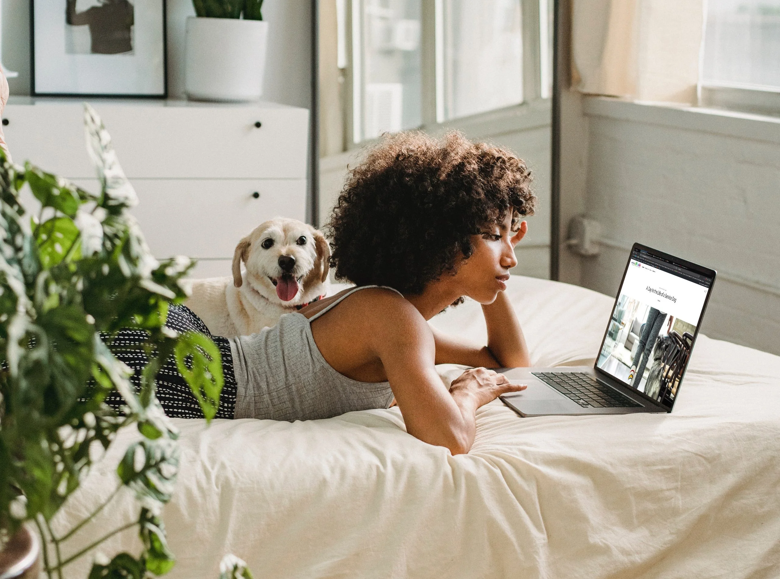 Woman on bed with dog